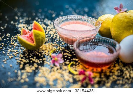 Guava Face Mask For Dry Skin On A Wooden Surface With Vivid Colors I.e., Guava Pulp, Egg Yolk, Oatme