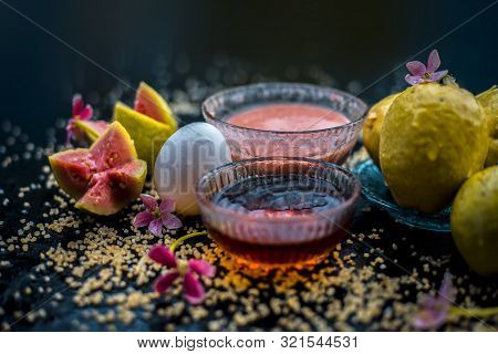 Guava Face Mask For Dry Skin On A Wooden Surface With Vivid Colors I.e., Guava Pulp, Egg Yolk, Oatme
