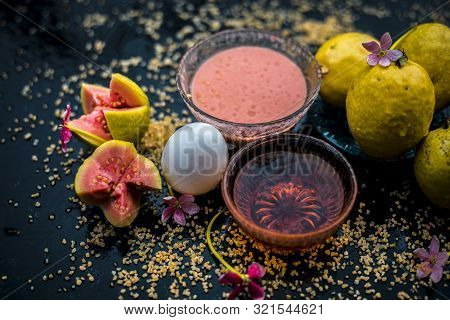 Guava Face Mask For Dry Skin On A Wooden Surface With Vivid Colors I.e., Guava Pulp, Egg Yolk, Oatme