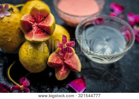 Guava Face Mask For Glowing Skin On A Wooden Surface With A Blurred Background Consisting Of Some Gu