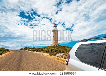 Cape Du Couedic Lighthouse Under Beautiful Sky By The Road With Suv Driving By, Kangaroo Island