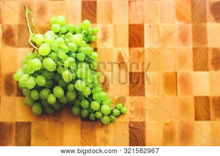 Green Grape On The Wooden Cutting Board