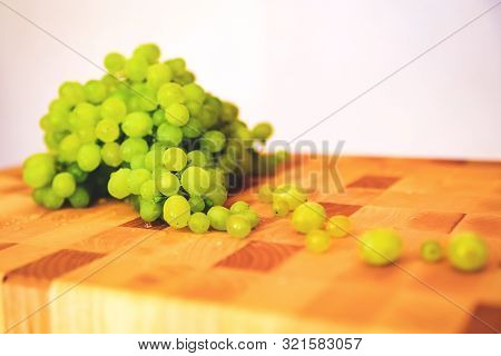 Green Grape On The Wooden Cutting Board