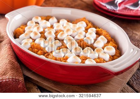 A Delicious Homemade Sweet Potato Casserole With Marshmallow Topping.