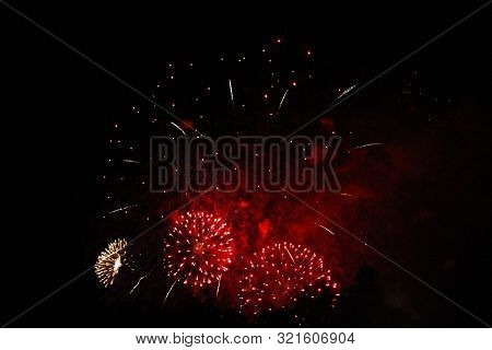 The Celebration Colored Firework Flashing In The Black Night Sky Background