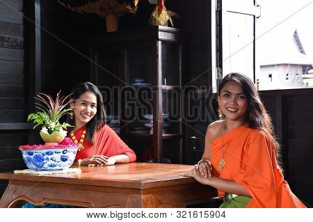 Kanchanaburi, Thailand, 09.09.2019: Beautiful Thai Girls In Traditional Thai, Siamese Dress With Gre