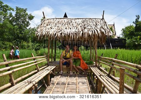 Kanchanaburi, Thailand, 09.09.2019: Beautiful Thai Girl And A White Boy In Traditional Thai, Siamese