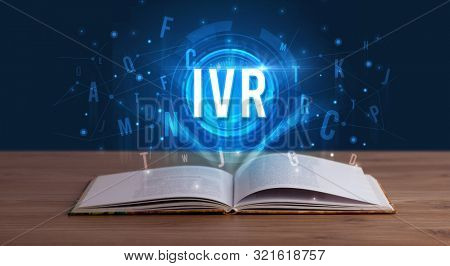 IVR inscription coming out from an open book, digital technology concept