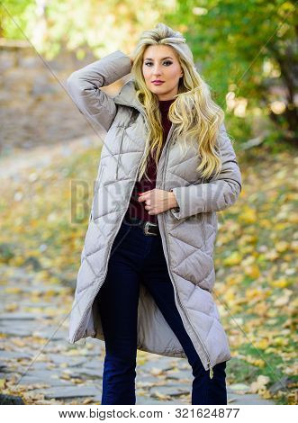 How To Rock Puffer Jacket Like Star. Puffer Fashion Trend Concept. Girl Fashionable Blonde Walk In A