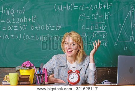 Teacher With Alarm Clock At Blackboard. Back To School. Teachers Day. Study And Education. Modern Sc
