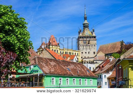 Sighisoara, Romania, May 15, 2019: Old And Colorful Houses In Sighisoara Citadel. Medieval Architect