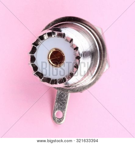 Radio Connector On Pink Background At Dry Sunny Summer Day