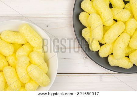 Lot Of Whole Salted Yellow Corn Puff On White Ceramic Plate On Gray Ceramic Plate Flatlay On White W
