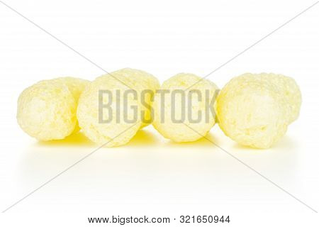Group Of Four Whole Salted Yellow Corn Puff Isolated On White Background