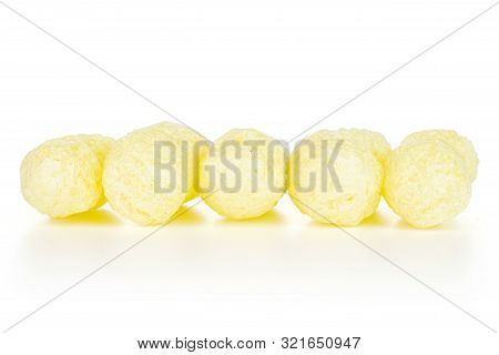 Group Of Five Whole Salted Yellow Corn Puff Isolated On White Background
