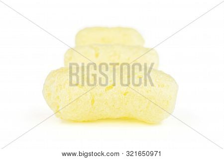 Group Of Three Whole Salted Yellow Corn Puff Isolated On White Background