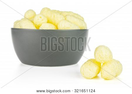 Lot Of Whole Salted Yellow Corn Puff In Gray Ceramic Bowl Isolated On White Background