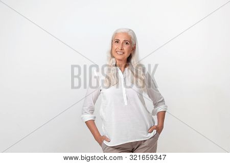 Portrait Of Beautiful Mature Woman On Light Background