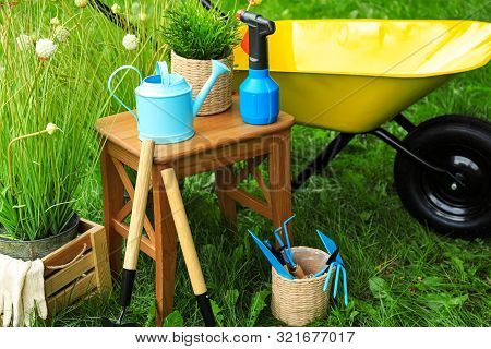 Composition With Gardening Tools On Green Grass
