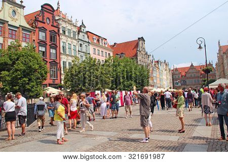 Gdansk / Poland. 24 June 2019: 
Tourists Stroll And Take Pictures Of Gdansk. Many Tourists Walk Arou