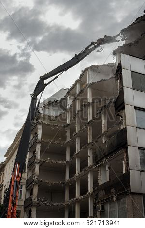 Demolition Pulveriser Demoliting Building In The City