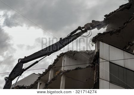 Demolition Pulveriser Demoliting Building In The City