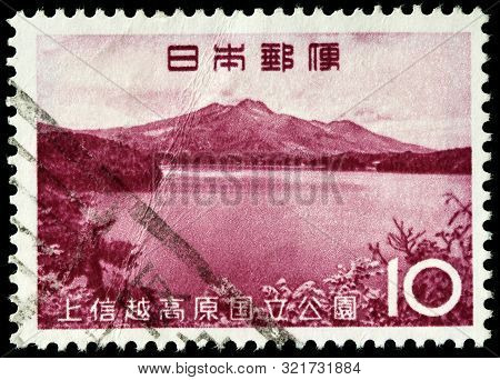 Luga, Russia - September 01, 2019: A Stamp Printed By Japan Shows View Of Lake Nojiri And Mount Myok