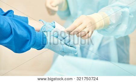 Ophthalmology Laser Microscope Operation. Clinic Room With Doctor And Parient. Gloves And Medicine T