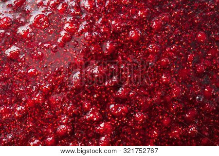 Beautiful Glare Texture Of Raspberry Jam Closeup
