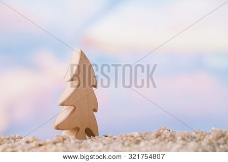 christmas tree on a beach,  ocean , sky and seascape