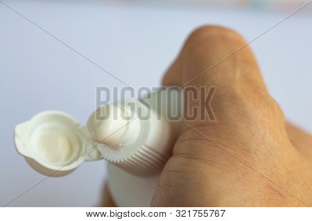 Woman's Hands Squeezing Toothpaste On White Background, Close Up & Macro Shot, Selective Focus, Heal