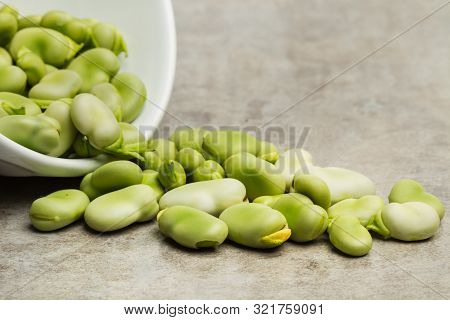 Raw Broad Beans On A Marble Table