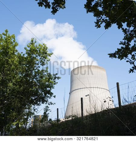 Steam And Blue Sky Above Large Chimney Of Nuclear Power Plant Near German Town Lingen In Lower Saxon