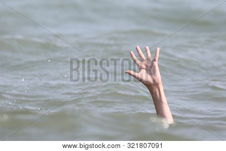 Drowning Bather Holds Up His Hand For Help