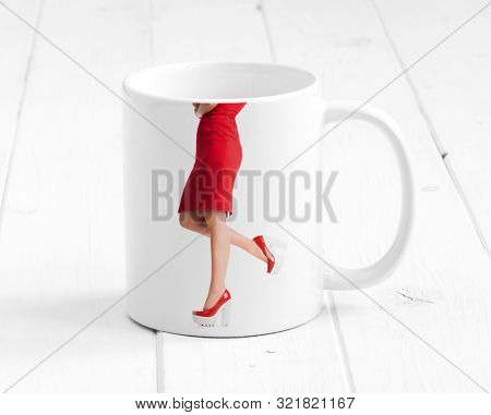 Ceramic cup standing on white wooden boards