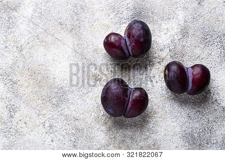 Ugly Plums. Abnormal Organic Conjoined Fruit In Shape Of Heart Or Butterfly