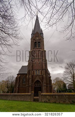 St. Martin Church, Griethhausen, Kleve, Germany On A Cloudy Day In Springtime