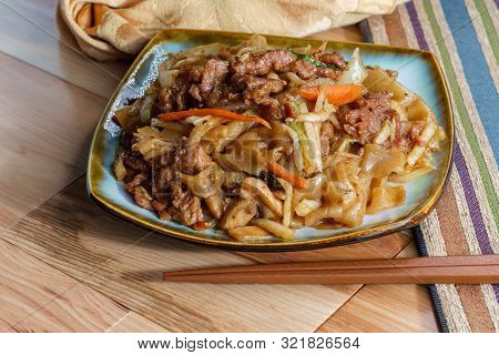 Stir Fried Chinese Beef Chow Fun With Hor Fun Wide Rice Noodles Cabbage And Carrots