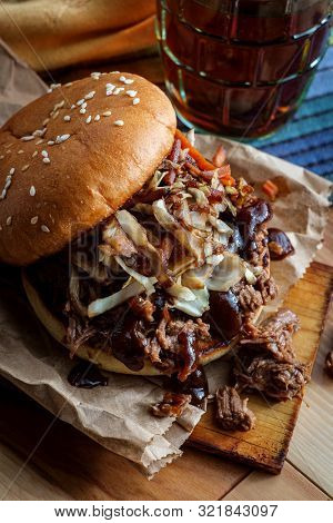 Southern American Cuisine Pulled Pork Burger Sandwich Topped With Cole Slaw