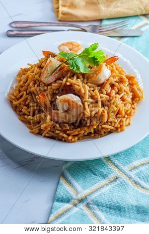 Tail-on Shrimp Spanish Rice With Vermicelli Pasta On Marble Kitchen Table