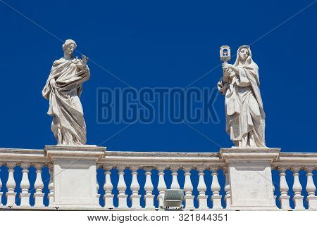 Detail Of The Statues Of Saints That Crown The Colonnades Of St. Peter Square Built On 1667 On The V