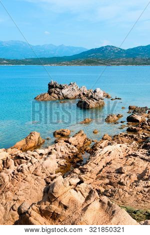 a view of the rock formations in La Tonnara, on the Southern coast of Corsica, France, and a calm Mediterranean sea