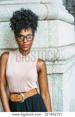 Portrait Of Young African American Woman In New York. Young Black Female College Student With Afro H