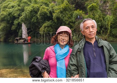 Happy Asian Senior Couple Having Vacation In China