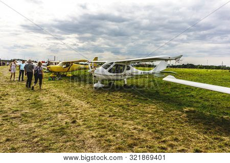 KALININGRAD, Russia - August 18, 2019: 100 Anniversary First European Airport Devau Fest, Ultra Light Propeller Screw Plane Ready for Flight