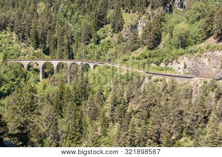 View From The Historic Landwasser Viaduct Of The Rhaetian Railway Near The Village Filisur, Swiss Al