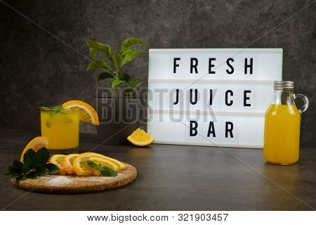 Fresh Juice Bar Concept. Oranges With Fresh Orange Juice