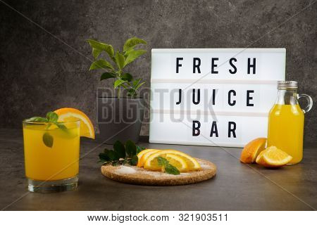 Fresh Juice Bar Concept. Oranges With Fresh Orange Juice