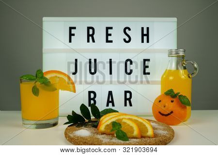 Fresh Juice Bar Concept. Oranges With Fresh Orange Juice