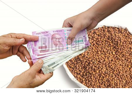 Farmer Selling Crops, Hand Giving Indian 500 And 2000 Rupee Bank Notes Over Bag, Burlap Full Of Blac